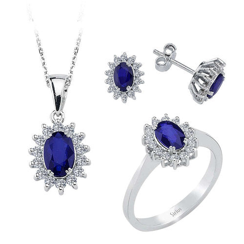 Diamond and oval sapphire jewelry set in 14 K white gold