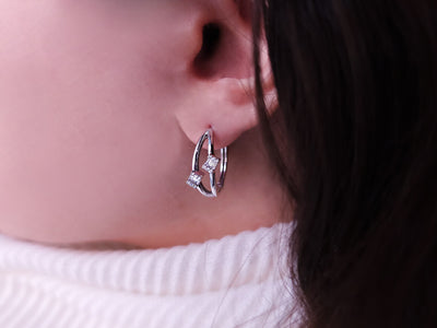 0.20 carat baguette diamond earrings in 14 carat white gold