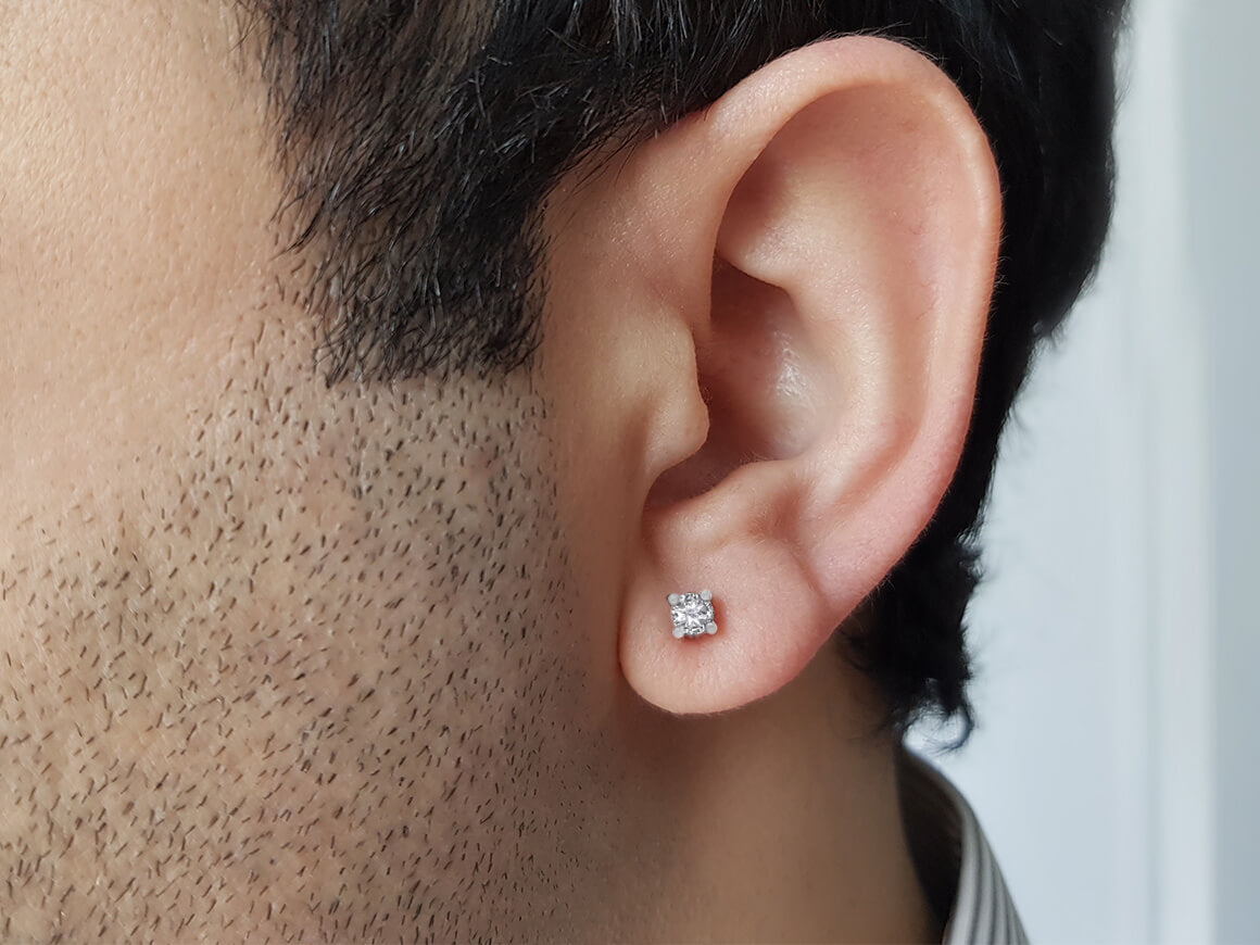 0.33 carat white sapphire solitaire men's earring in 14 K white gold 