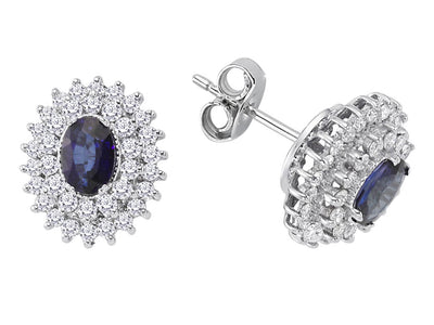 Two-row diamond and oval sapphire stud earrings in 14K white gold