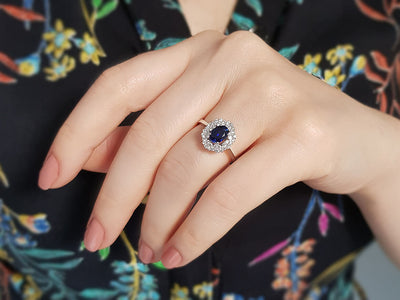 Double row diamond and oval cut sapphire ring