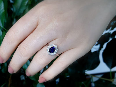 Double row diamond and oval cut sapphire ring