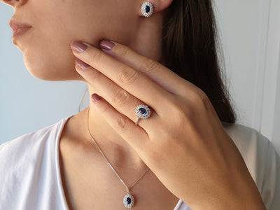 Two-row diamond and oval sapphire stud earrings in 14K white gold
