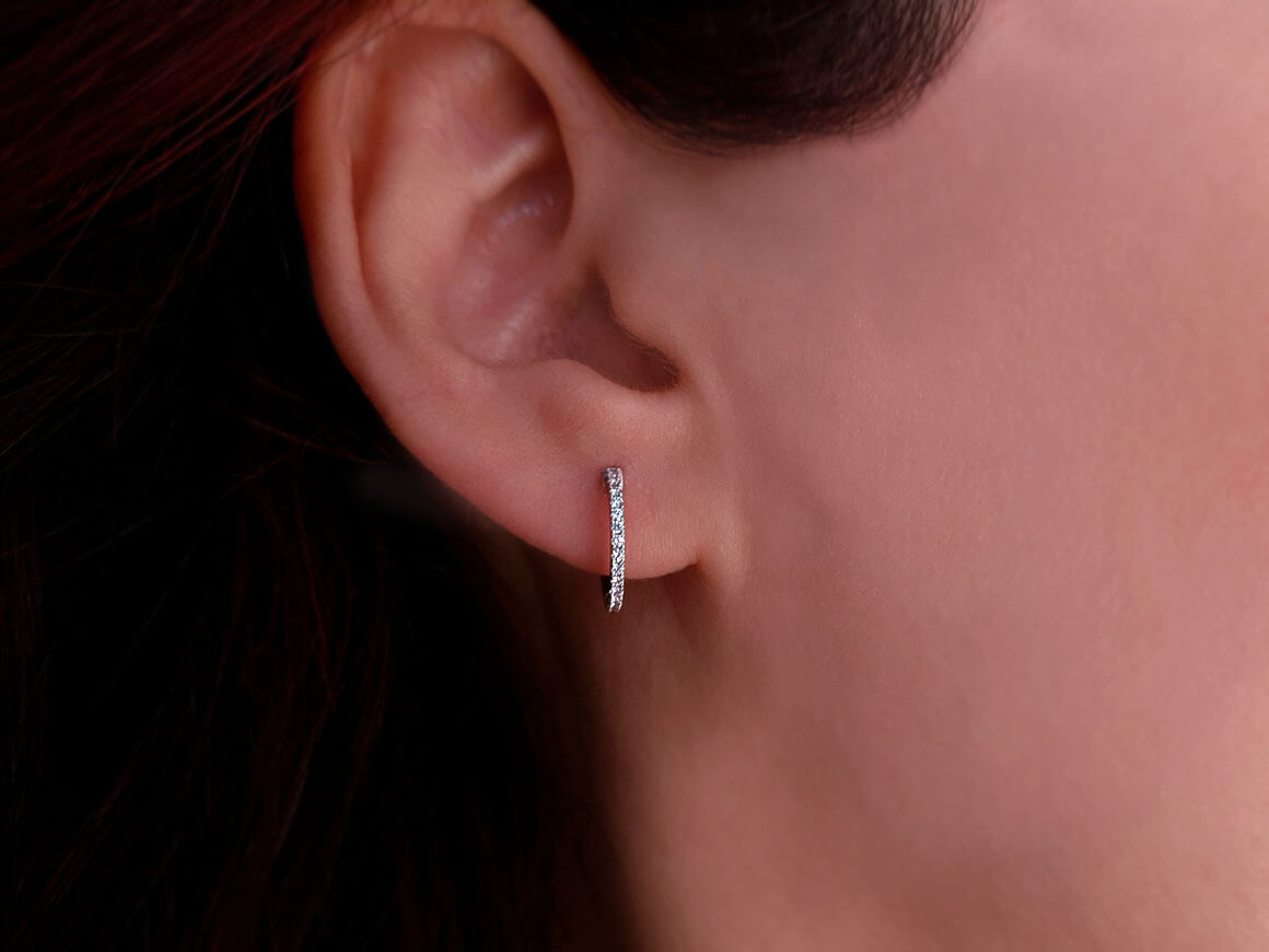 0.14 carat diamond hoop earrings in 14 carat white gold