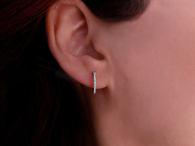0.14 carat diamond hoop earrings in 14 carat white gold