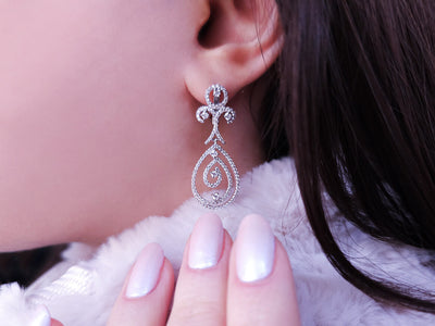 Total 1.63 carat diamond earrings in 14K