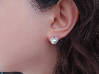 Diamond and natural pearl earrings in 14 K white gold