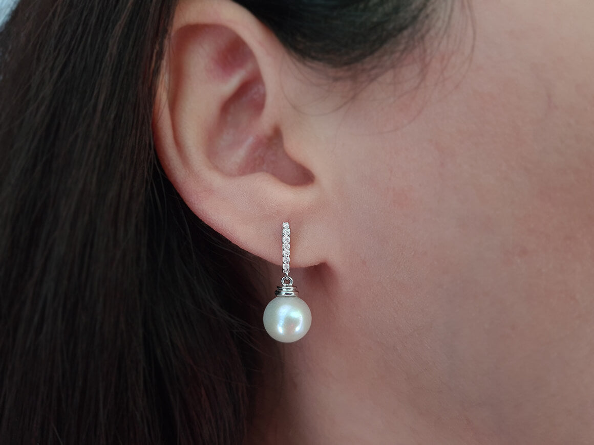 Diamond and natural pearl earrings in 14 K white gold