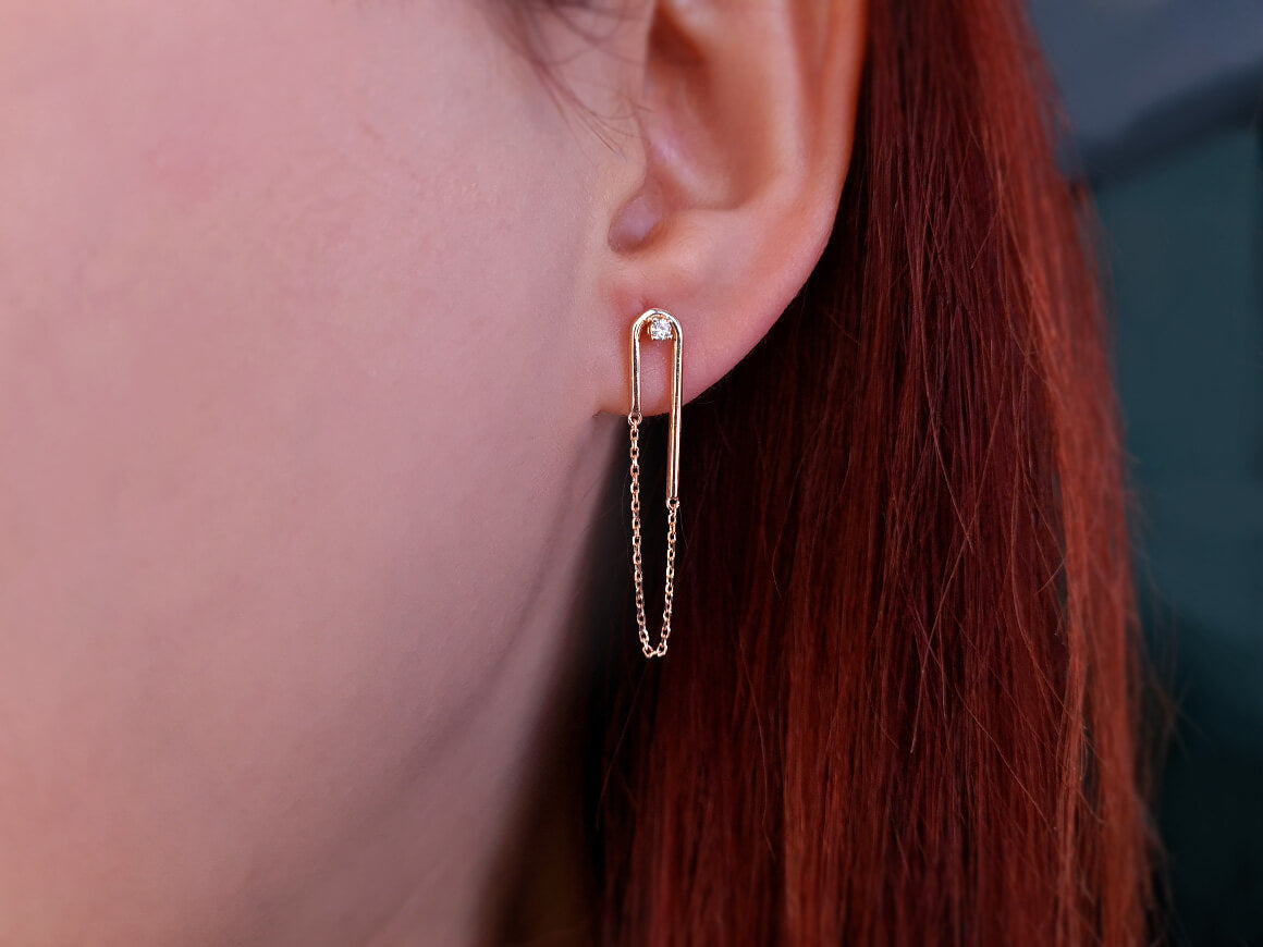 0.06 carat diamond Nile earrings in 14 K red gold