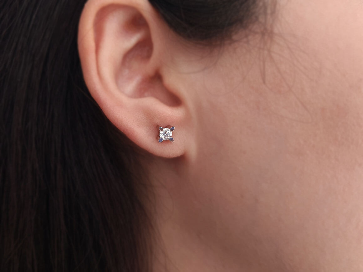 0.48 carat diamond solitaire stud earrings in 14 K white gold