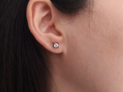 0.48 carat diamond solitaire stud earrings in 14 K white gold