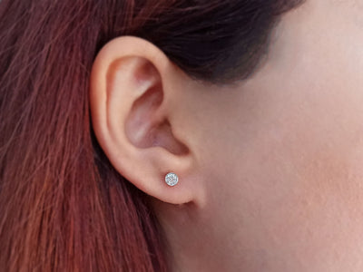 0.38 carat diamond solitaire stud earrings in 14 K white gold