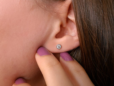 0.28 carat diamond solitaire earrings