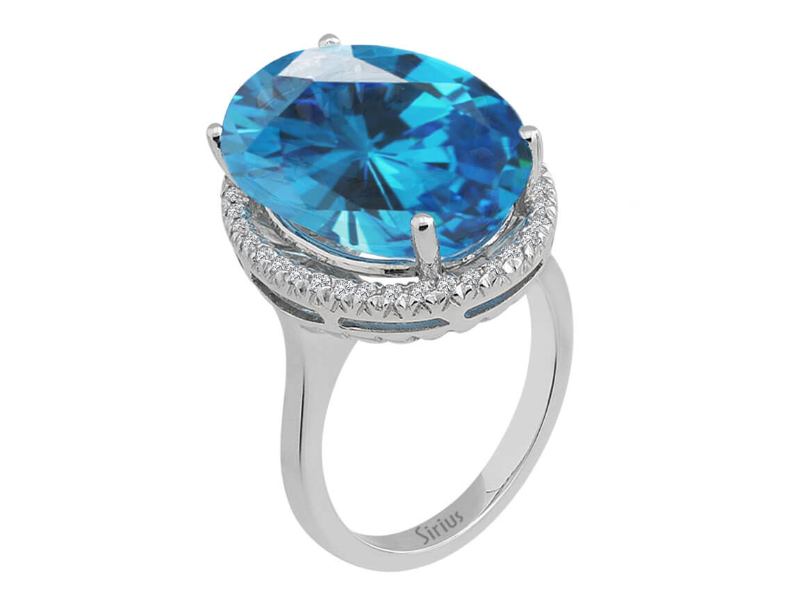 Diamond and oval blue topaz ring in 14 K white gold