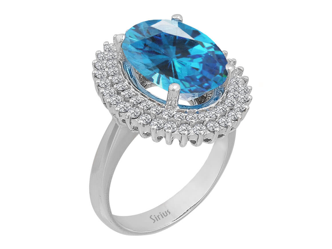 Diamond and Oval Blue Topaz Ring in 14 K White Gold