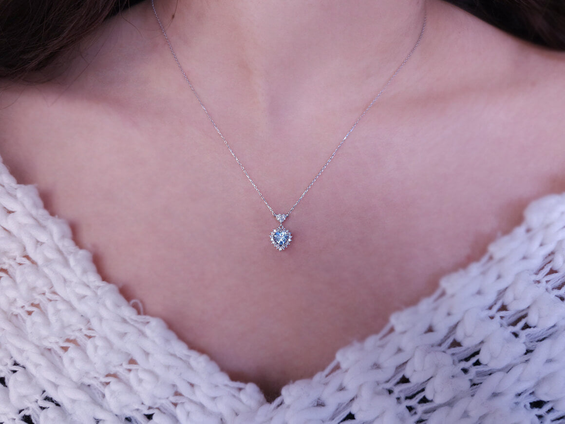 Diamond and heart cut blue topaz jewelry set in 14 K white gold