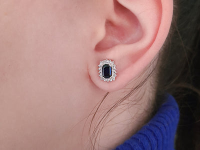 Diamond and octagon cut sapphire earrings in 14 carat white gold