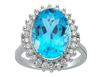 Diamond and oval cut blue topaz ring in 14 carat white gold