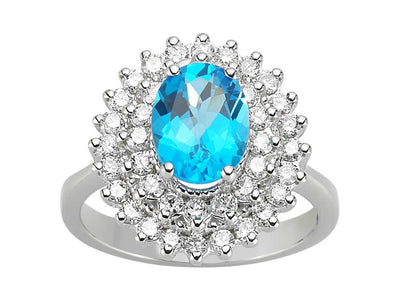 Diamond and oval blue topaz ring in 14 K white gold