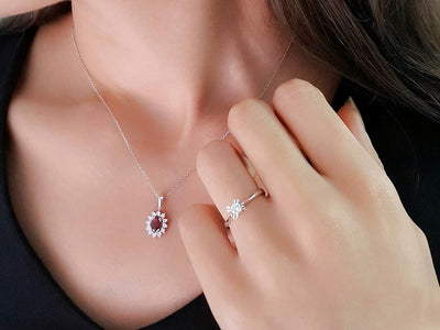 Diamond and oval ruby necklace in 14 K