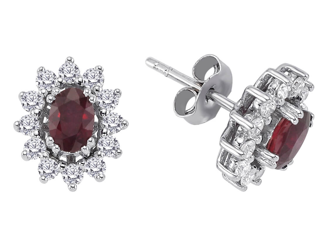 Diamond and oval ruby earrings in 14 carat white gold
