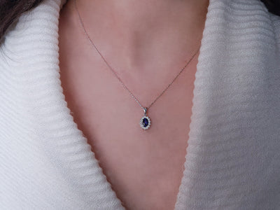 Diamond and oval sapphire jewelry set in 14 K white gold