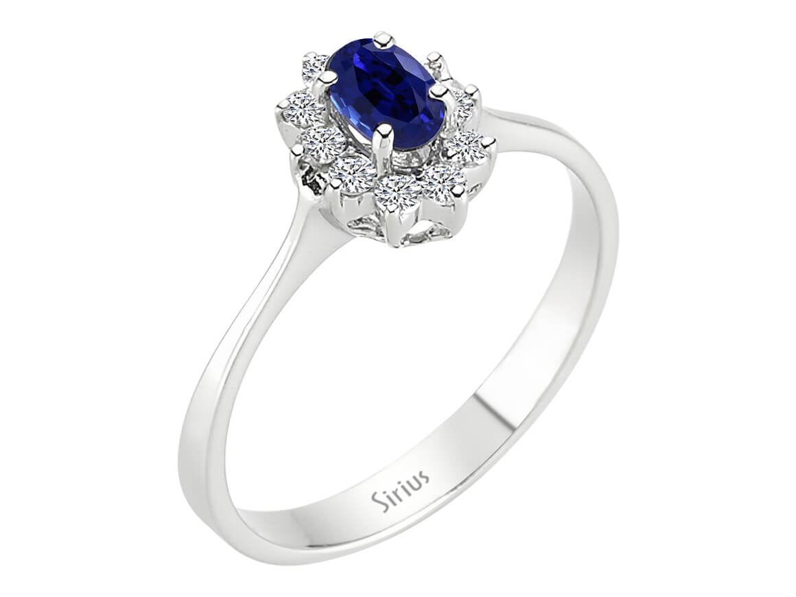 Diamond and oval sapphire ring in 14 K white gold