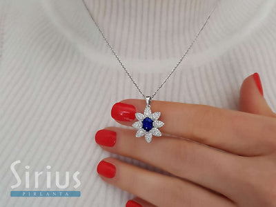 Diamond and oval sapphire necklace in 14 K white gold