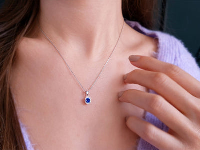 Diamond and oval sapphire necklace