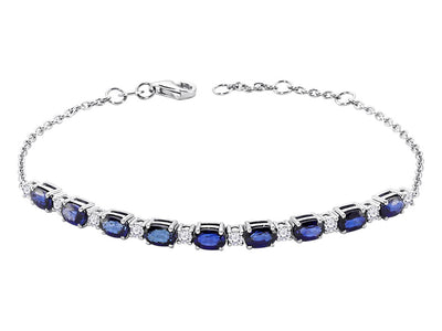 Diamond and oval sapphire bracelet in 14 carat white gold