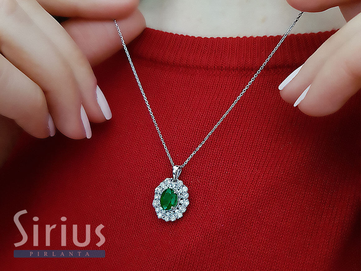 Diamond and drop emerald necklace in 14 K