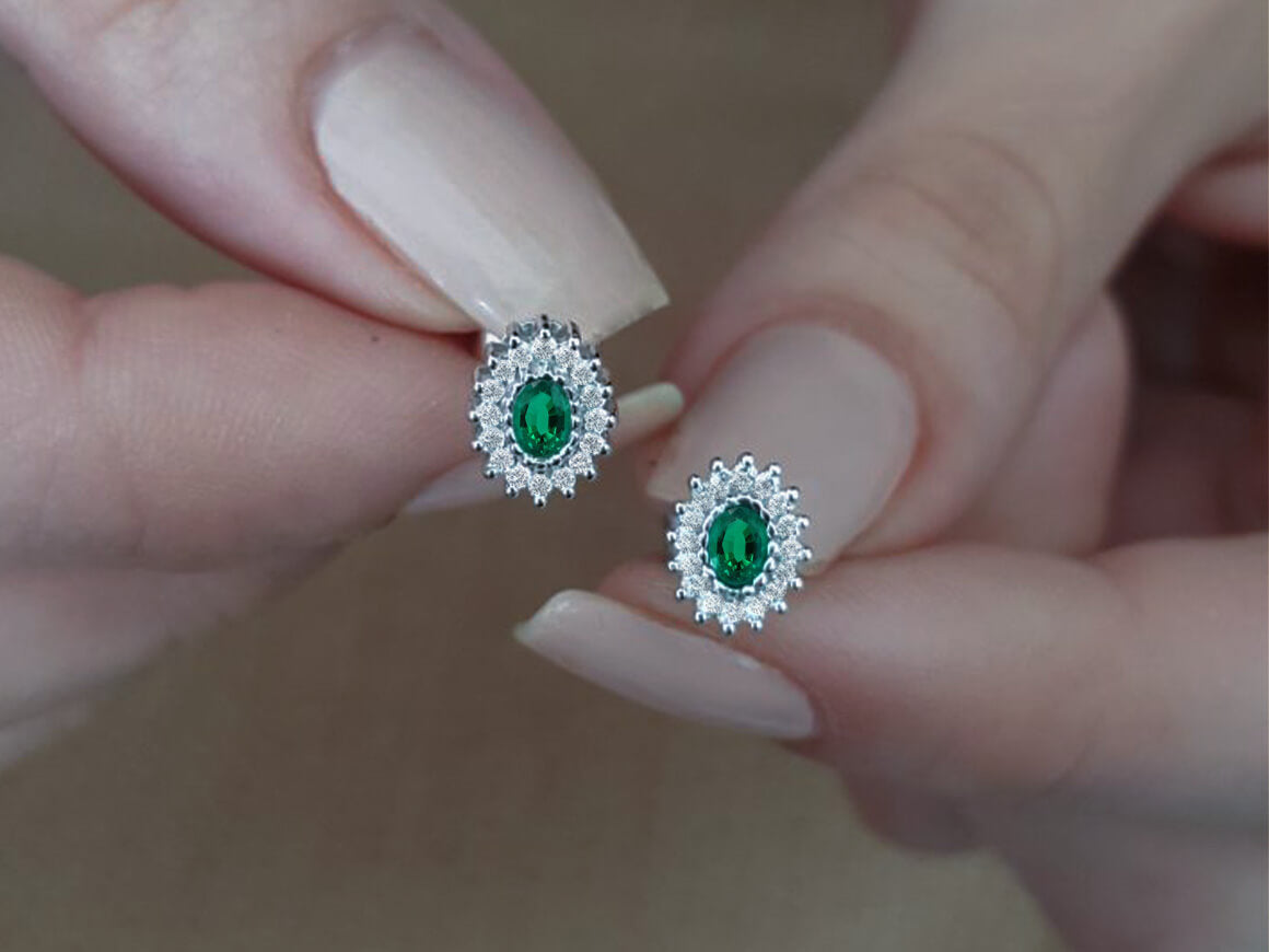 Diamond and oval emerald earrings in 333 8 carat gold