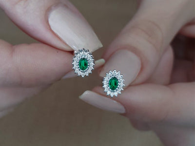 Diamond and oval emerald earrings in 333 8 carat gold
