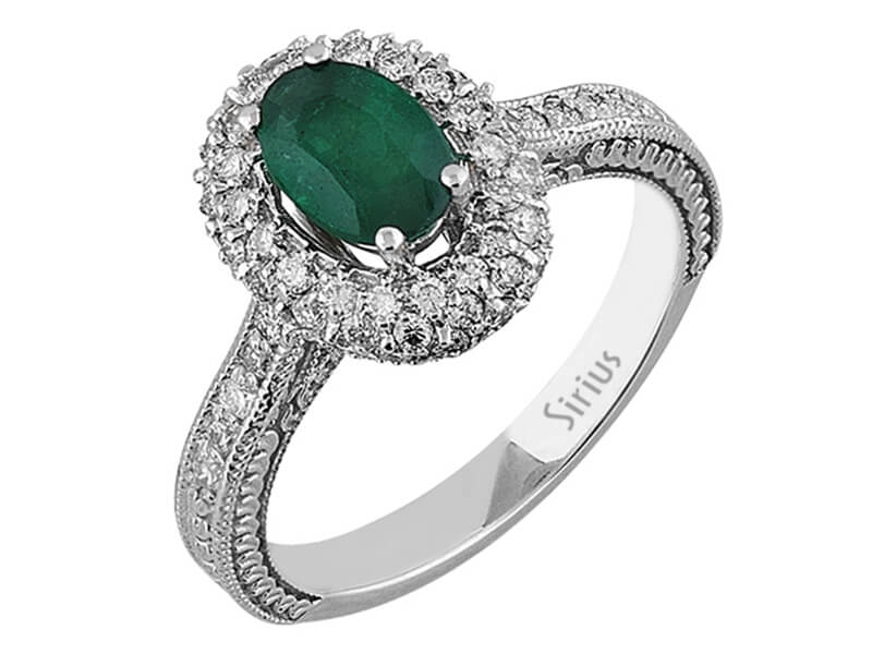 Diamond and oval emerald ring in 14 carat white gold