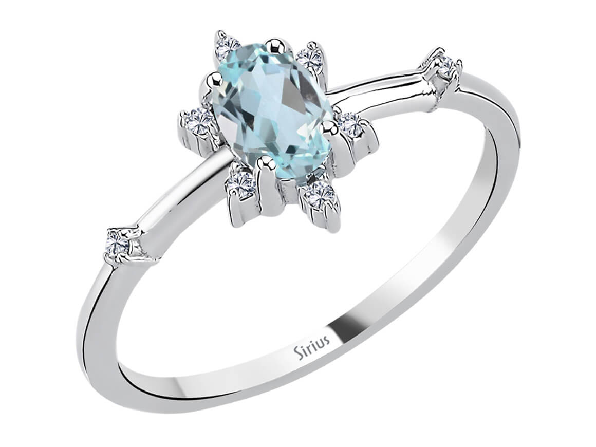 Eiskristall Ring mit Diamant und himmelblauem Topas - handgefertigter Diamantschmuck aus Feingold | Sirius Diamant