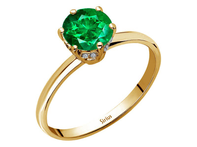 Diamond and emerald plano ring in 14 K yellow gold
