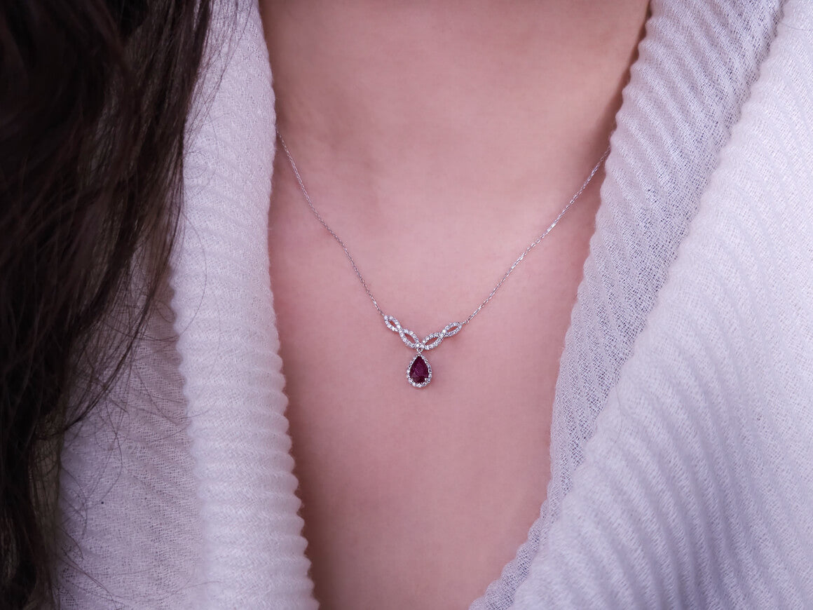 Diamond and teardrop ruby necklace in 14 K white gold