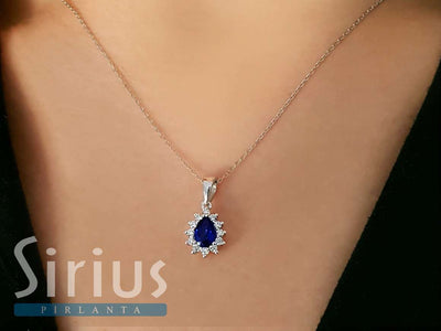 Diamond and drop sapphire necklace in 14 K