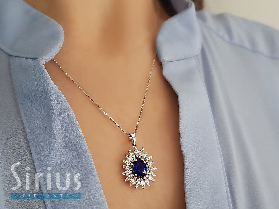 Diamond and drop sapphire necklace in 14 K white gold