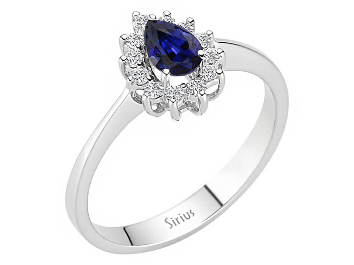 Diamond and pear sapphire ring in 14 K white gold