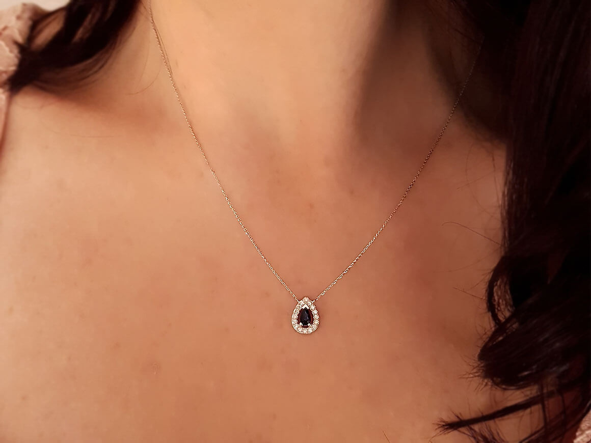 Diamond and drop sapphire necklace in 14 K white gold