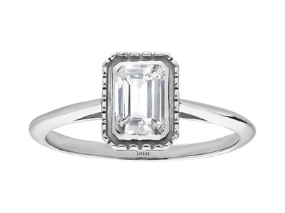 0.70 carat emerald-cut white sapphire solitaire ring in 14k white gold