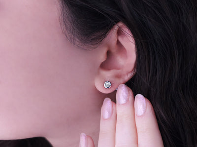 F color 0.14 carat stud earrings in 585 14K white gold