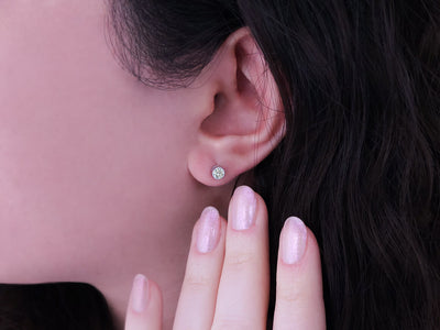 0.34 carat diamond solitaire stud earrings in 14 carat white gold