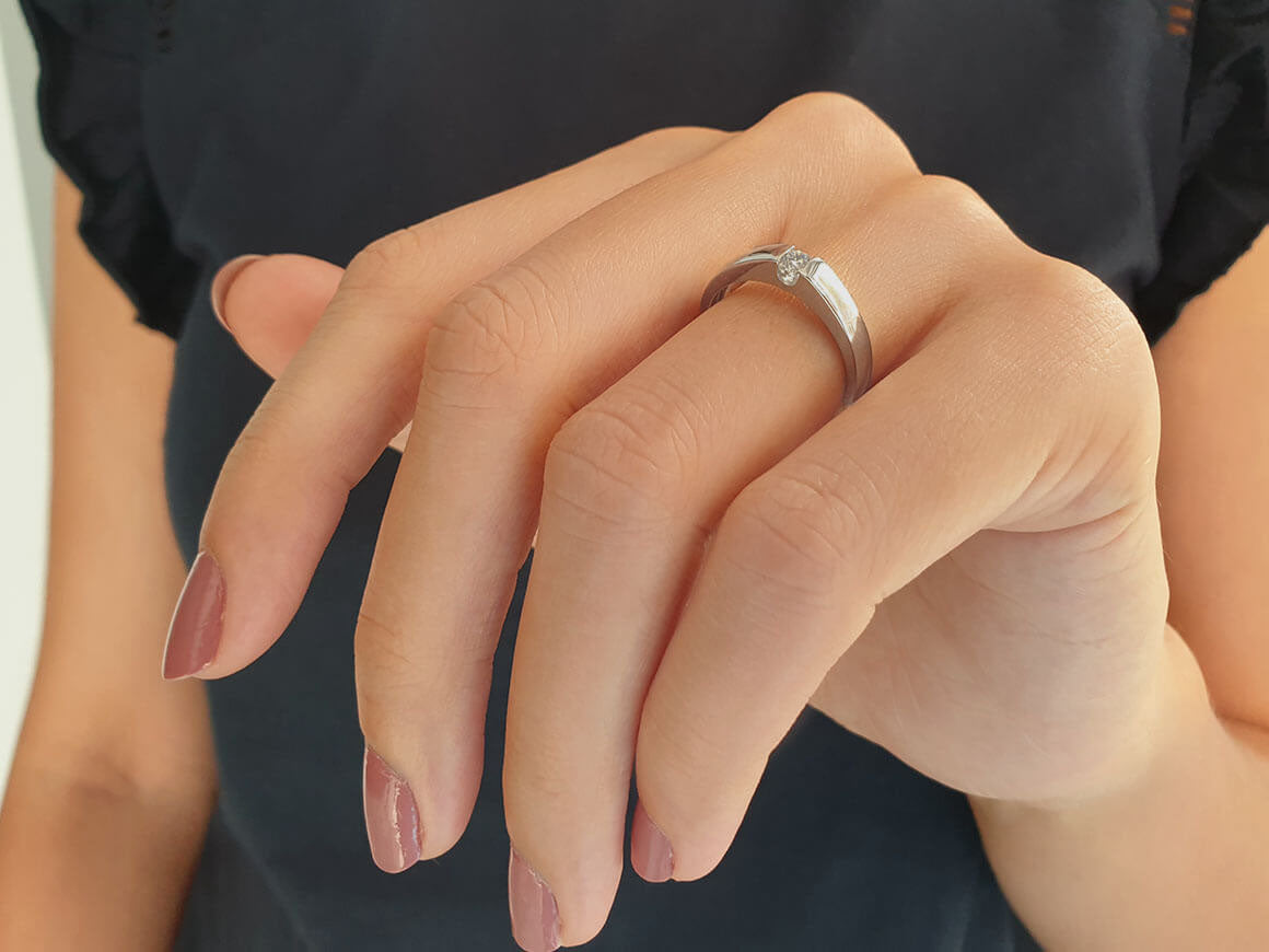 0.11 carat diamond solitaire ring in 14 K white gold