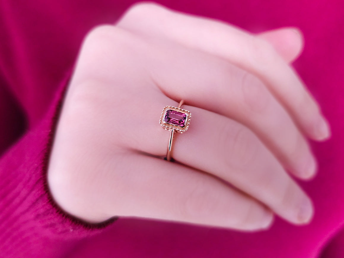 Octagon cut pink tourmaline ring in 14 carat red gold