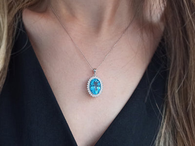 Diamond and oval cut topaz necklace in 14 K white gold
