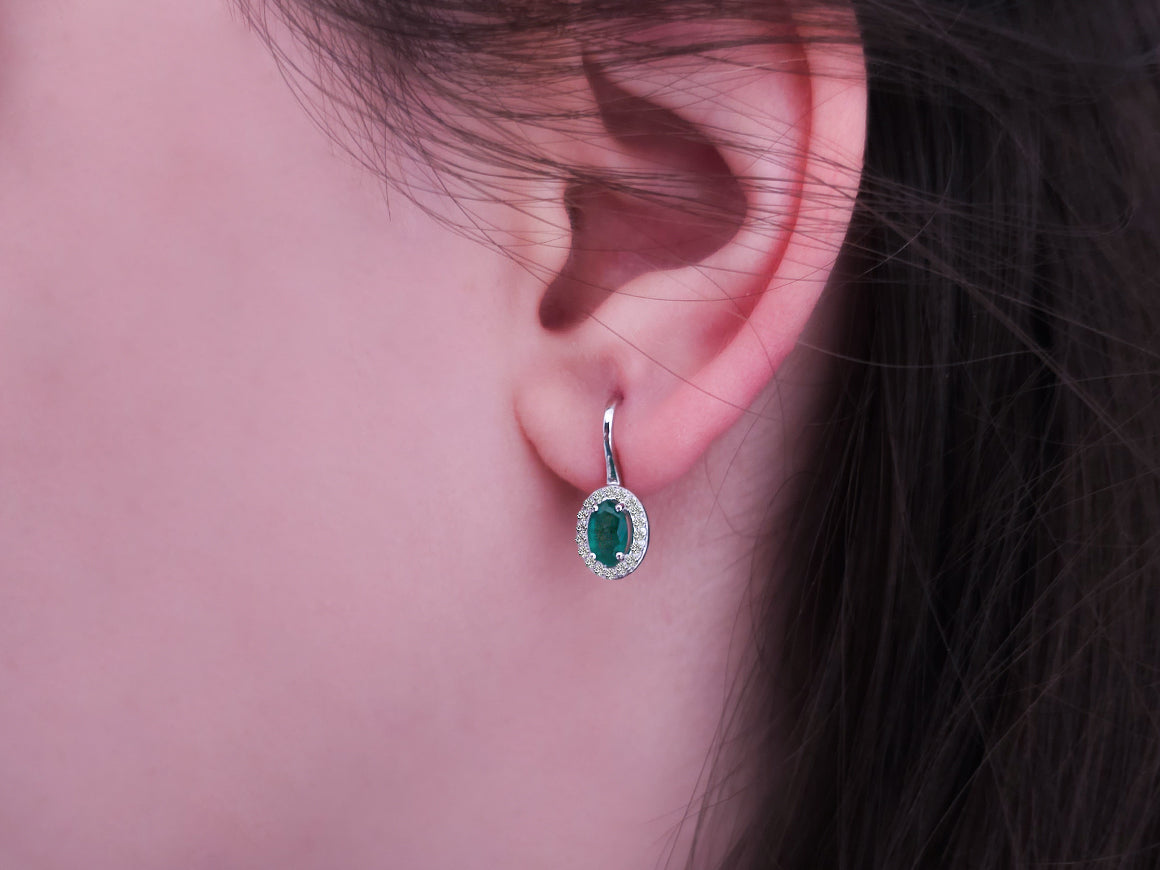 Diamond and oval emerald earrings in 333 8 carat white gold