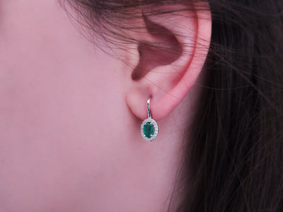 Diamond and oval emerald earrings in 333 8 carat white gold
