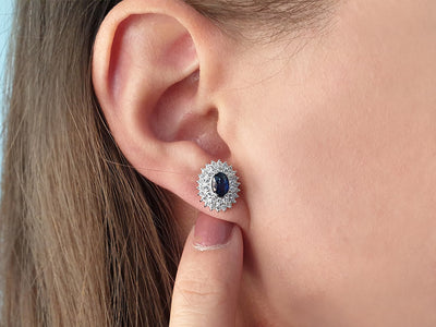 Two-row diamond and oval sapphire stud earrings in 14K white gold